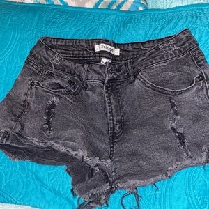 refuge brand shorts, size 6, and the color is a faded black.
